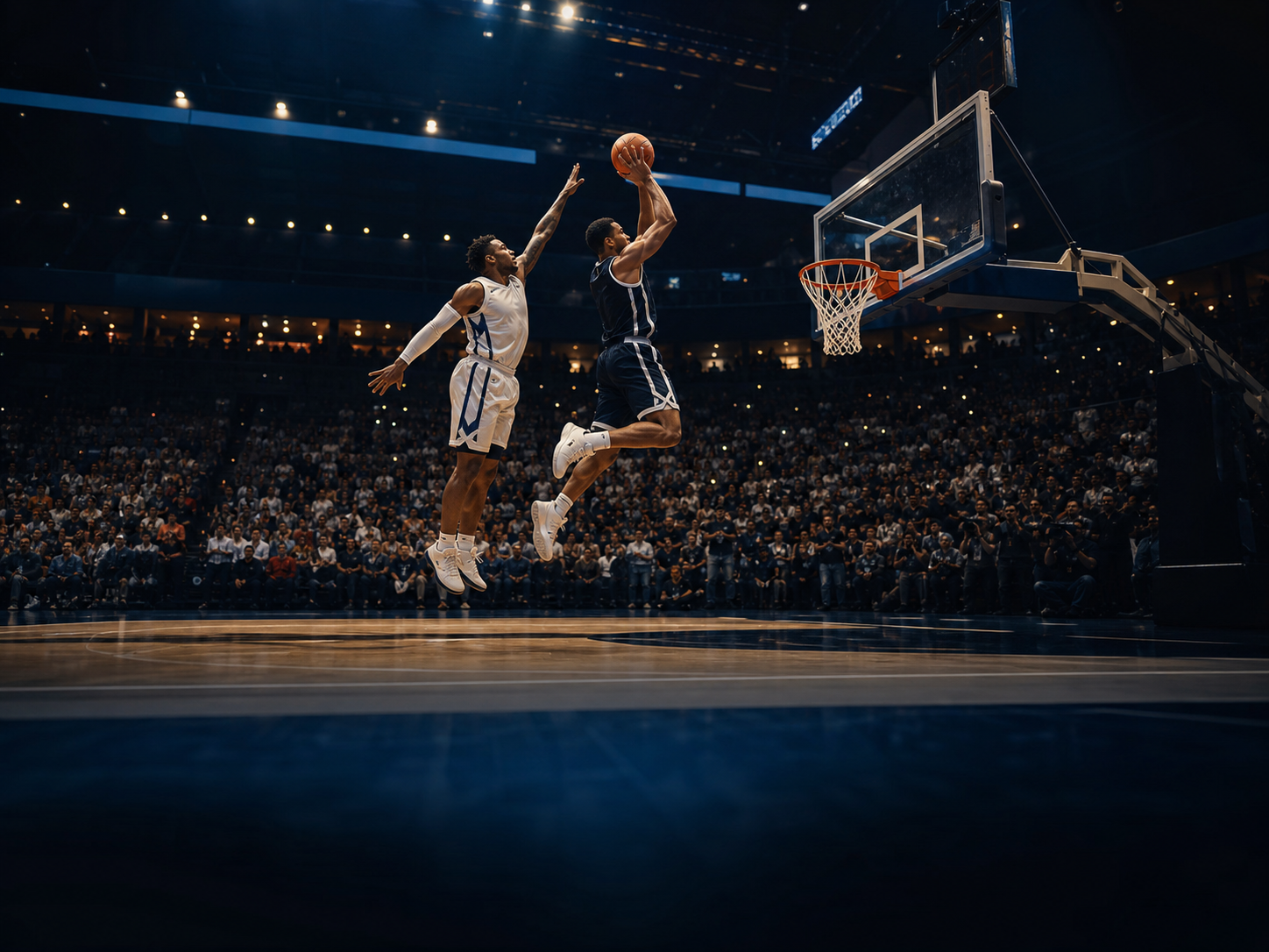Basketball players contesting a shot in a full indoor arena